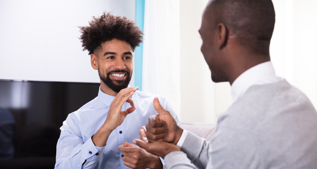 Two men making sign language