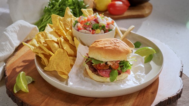 A bowl of pickerel cheek ceviche and a hamburger