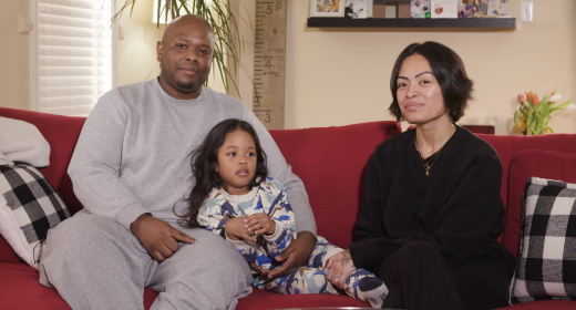 The Hutchinson family smiles into the camera.